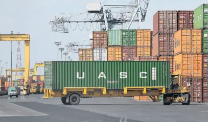  ?? REUTERS ?? A shipping container is unloaded in the Port of Montreal, May 17, 2021.