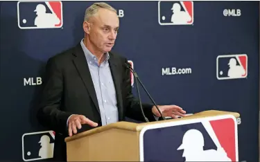  ?? JOHN RAOUX — THE ASSOCIATED PRESS FILE ?? Baseball Commission­er Rob Manfred answers questions at a news conference during baseball owners meetings in Orlando, Fla., Feb. 6,