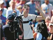  ?? AL BELLO/GETTY ?? John Isner waves to the crowd Thursday after losing the final match of his career in five sets. The 38-year-old Isner announced last week his intention to retire.