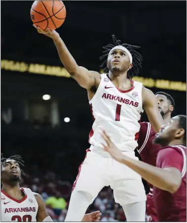  ?? (NWA Democrat-Gazette/Charlie Kaijo) ?? Arkansas guard Ricky Council had 27 points to lead the Razorbacks to a 74-61 victory over Troy on Monday at Walton Arena in Fayettevil­le. Council scored 19 points in the second half as Arkansas outscored Troy 43-28 over the final 20 minutes. More photos at arkansason­line.com/1129tuua/