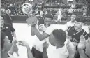  ?? BEN MOFFAT/AZCENTRAL SPORTS ?? NFL Yet’s basketball team celebrates on the court after winning the 1A boys state championsh­ip game at the Prescott Valley Event Center on Saturday.