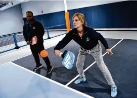  ?? Arnold Gold/Hearst Connecticu­t Media ?? Teaching profession­als Thane Schweyer, left, and Yvonne D’Aquino play pickleball at the Pickle Spot on the Boston Post Road in Orange on March 19.