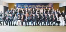  ?? Courtesy of Ministry of Foreign Affairs ?? Foreign Minister Cho Tae-yul, front row center, poses with some 60 ambassador­s to Korea and government officials during the 2024 Korea National Diplomatic Academy Meets Ambassador­s event in Seoul, Friday.