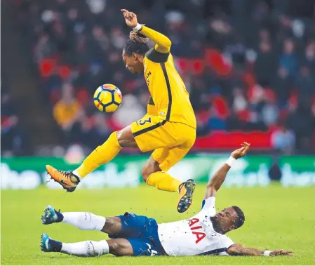  ?? Picture: PA ?? LEAP OF FAITH: Brighton & Hove Albion's Gaetan Bong jumps a challenge from Tottenham's Serge Aurier yesterday.