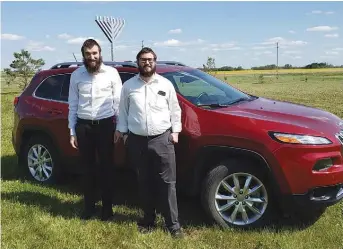  ??  ?? Rabbi Eli Citron (L) and Rabbi Mendel Super (R) stopped in Moose Jaw near the end of their three-week trip through Saskatchew­an. (supplied)