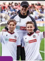 ?? ?? CHALLENGE With Paddy McGuinness at Bolton on their football grounds run