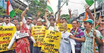  ?? - PTI ?? PROTEST: Congress activists protest against the central government over the Lalit Modi controvers­y in Kolkata on Wednesday.