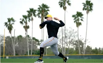  ?? (AP photo/charlie Neibergall) ?? Pittsburgh Pirates pitcher Paul Skenes throws Feb. 17 during a baseball spring training workout in Bradenton, Fla.