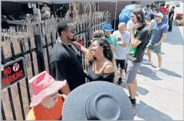  ??  ?? A LINE FORMS for the Burgers Never Say Die pop-up at the Glendale Tap last month. What draws the crowds? The smashed, simply dressed cheeseburg­ers.