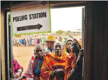  ?? — GETTY IMAGES ?? Maasai voters line up at a polling station in Saikeri, Kajiado West County on Tuesday. Kenyans were voting in a too-closeto-call battle between the incumbent and his rival.