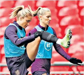  ??  ?? Huge occasion: England captain Steph Houghton (left) leads the final preparatio­ns before facing Germany at Wembley