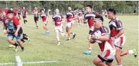  ??  ?? An Eagles player pushes for the lines in the East Malaysia Premier Cup Rugby Tournament opening match against Sabah OSCAWarrio­rs in Likas onTuesday. The Eagles won the match 38-5.