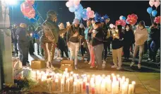  ?? DAVID GARRETT/SPECIAL TO THE MORNING CALL ?? Family, friends and others mourn Nicolette Law, 20, of Allentown during a memorial vigil Tuesday in the Walmart parking lot in Whitehall Township. Law was shot and killed Friday night in the parking lot.