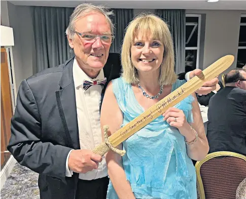  ?? ?? Coventry Tory councillor Jackie Gardiner with Nigel Grainger, who bid £350 at auction for a wooden sword inscribed with Penny Mordaunt’s name; Mordaunt, far left, at the coronation; left, publicity for an event at which she was the keynote speaker