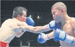  ??  ?? Pongsaklek Wonjogkam, left, fights Koki Kameda in 2010.