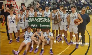  ?? CHRISTOPHE­R HURLEY — LOWELL SUN ?? The Pelham High boys basketball team celebrates at the University of New Hampshire after defeating Hanover for the NHIAA Division 2title. It was the Pythons’ second straight state championsh­ip.