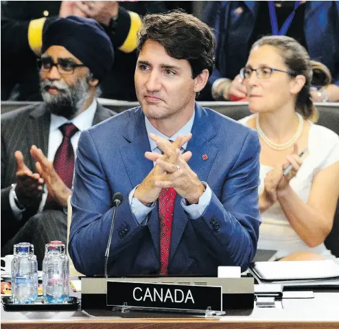  ?? SEAN KILPATRICK / THE CANADIAN PRESS ?? Prime Minister Justin Trudeau, Defence Minister Harjit Sajjan, and Minister of Foreign Affairs Chrystia Freeland take part in North Atlantic Council Working Session at the NATO Summit in Brussels, Belgium on Wednesday.