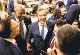  ?? Max Whittaker For The Times ?? HIRING Antonio Villaraigo­sa, center, is part of a publicity and lobbying effort by Coinbase. Above, he talks at the state Capitol last year during a swearing-in event.