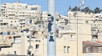  ?? — AFP photos ?? File photo shows a surveillan­ce camera is pictured at a checkpoint in the flashpoint Palestinia­n city of Hebron.