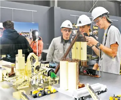  ?? STAFF FILE PHOTO BY ANGELA LEWIS FOSTER ?? Ridgeland High School students, from left, Jacob Rogers, Draven Chapman and Xavier Meyer look at equipment models at Astec Industries subsidiary Astec Inc., during a jobs fair last year.