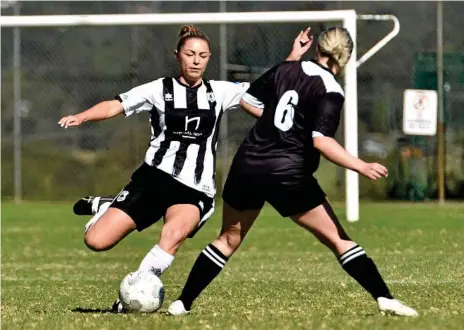  ??  ?? IN CONTROL: Willowburn player Shannon Tyrell (left) looks to take the ball past West Wanderers player Sarah Moore during a game earlier this season. Willowburn rounded out the regular season with a 3-2 win over Rockville on Saturday night helping them maintain an unbeaten record.