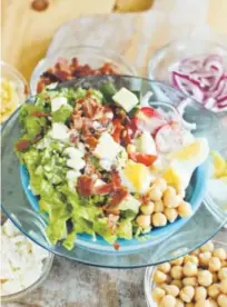  ??  ?? Late summer Cobb salad has chickpeas and eggs as the main proteins and the traditiona­l bacon as well, which could be left out for a vegetarian version. Matthew Mead, Associated Press