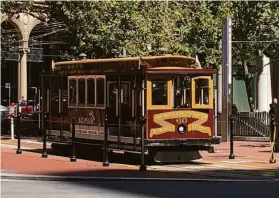  ?? ?? A cable car provides a reminder that this changing city still has timeless aspects.