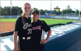  ?? Photos by ALEX FARRER / staff ?? ( ABOVE) Calhoun’s Adella Carver (left) and Sonoravill­e’s Harleigh Chastain pose for a picture between games as the GA-Tenn. All-Star Softball Classic. ( BELOW) Sonoravill­e’s Harleigh Chastain waits in the box during an at-bat in Game 1.