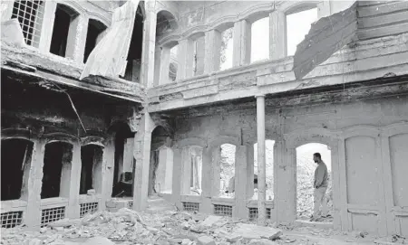  ?? SAMYAKULLA­B/AP ?? A house remains in ruins in the Old City section of Mosul — three years after forces defeated the Islamic State in Iraq’s second-largest city.