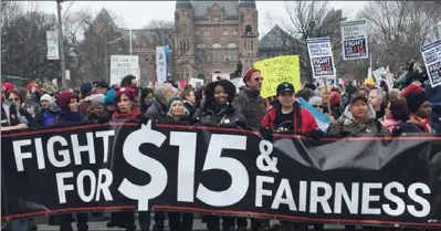  ?? NIL SENDIL PHOTO ?? People supporting the $15 and Fairness campaign demonstrat­e in front of Queen’s Park last January.