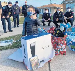  ?? PROJECT FIRE BUDDIES ?? The Oak Lawn chapter of Project Fire Buddies met its first buddy, AJ, on Dec. 22. AJ is battling leukemia, and the firefighte­rs involved with the nonprofit tried to make his Christmas a little brighter with a PlayStatio­n 5 and a mountain of other gifts.