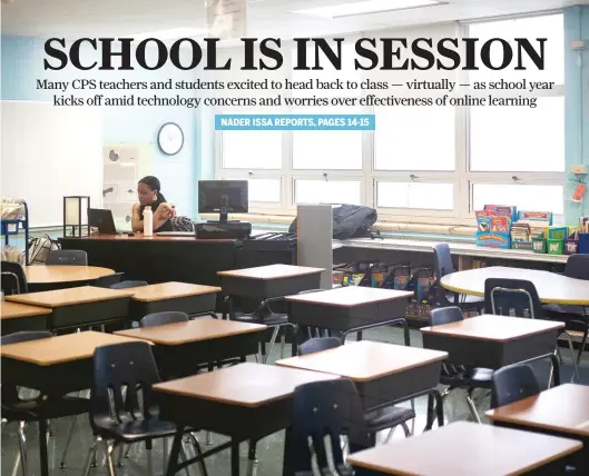  ??  ?? A teacher holds class Tuesday from an empty room at Dr. Martin Luther King Junior Academy of Social Justice in Englewood on the first day of school. PAT NABONG/SUN-TIMES