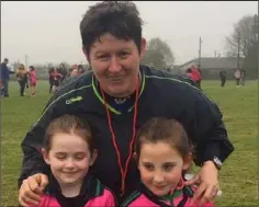  ??  ?? Referee Margaret Doherty with Clonard/Volunteers Under-8 girls Sarah Walsh and Lexi Turner who played their first Under-12 game recently against Glynn-Barntown.