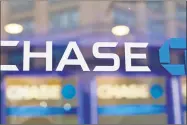  ?? Frank Franklin II / Associated Press ?? The nation’s six big Wall Street banks posted record or near-record profits in the first quarter, thanks largely to the recently enacted Trump tax law.