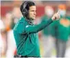  ?? JOHN RAOUX/AP ?? Hurricanes coach Manny Diaz signals to his players against Oklahoma State during the Cheez-it Bowl on Tuesday in Orlando.