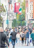  ?? AFP ?? Shoppers walk through busy Grafton Street in Dublin on Wednesday.