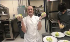  ??  ?? Student Abby Baczewski prepares a dish in Culinary Arts