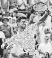  ?? John Minchillo / Associated Press ?? Novak Djokovic puts the finishing touch on his first Western &amp; Southern Open championsh­ip.