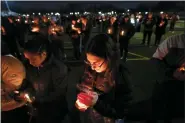  ?? PAUL SANCYA - THE ASSOCIATED PRESS ?? Lexi Bailey attends a candleligh­t vigil for Alexandria Verner at the Clawson High School football field in Clawson, Mich., Tuesday, Feb. 14, Verner was among the students killed after a gunman opened fire on the campus of Michigan State University Monday night.