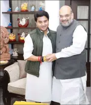  ??  ?? Jyotiradit­ya Scindia with Home Minister Amit Shah.