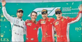  ??  ?? Ferrari's Sebastian Vettel (second from right) at the Australian GP podium with thirdplace­d Kimi Raikkonen (right) and Lewis Hamilton (left) on Sunday.