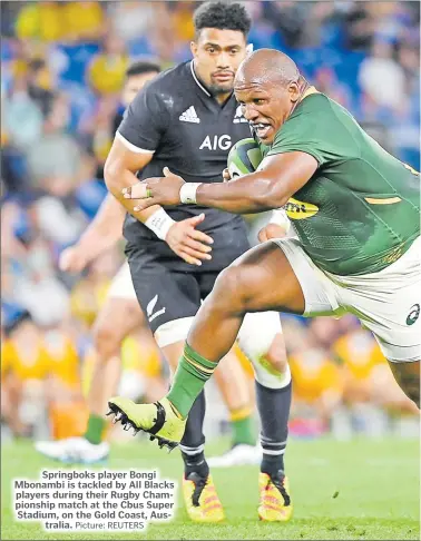  ?? Picture: REUTERS ?? Springboks player Bongi Mbonambi is tackled by All Blacks players during their Rugby Championsh­ip match at the Cbus Super Stadium, on the Gold Coast, Australia.