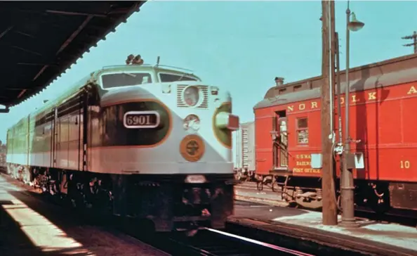  ??  ?? Below: Two Southern PAs moving from the engine terminal 11/2 miles to the east pass through the Bristol depot on August 8, 1956. They’ll wait at the station’s west end to replace an N&W J on train 45, the Tennessean. The N&W RPO car will go out on mail train 10.