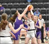  ?? ?? Sydney Spears attempts to make a goal while a Berryville Lady Bobcat tries to block her Tuesday, Jan. 18.