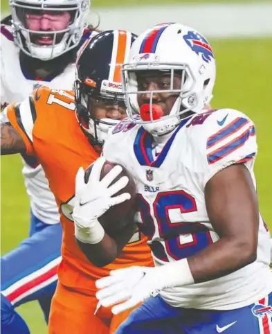  ?? TROY BABBITT / USA TODAY SPORTS ?? Devin Singletary and the Buffalo Bills ran their record to 11-3 and rang up their first AFC East title in 25 years with a 48-19 pounding of the Denver Broncos. Meanwhile, the New England Patriots are guaranteed a non-winning season.