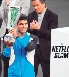 ?? — AFP photo ?? Alcaraz poses with the trophy at The Netflix Slam at Michelob ULTRA Arena in Las Vegas, Nevada.