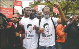  ?? The Associated Press ?? PROTESTS: Kenyan activists and civil society groups protest in solidarity with Ugandan pop star-turned-lawmaker Kyagulanyi Ssentamu, also known as Bobi Wine, in a march to the Ugandan embassy in Nairobi, Kenya on Thursday.