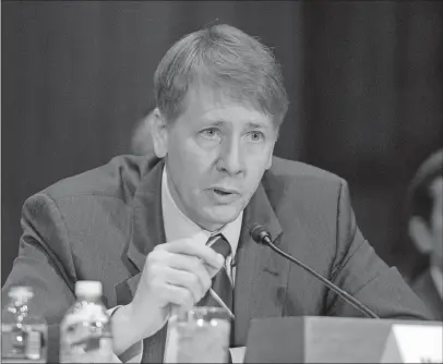  ?? [RON SACHS/CNP] ?? Richard Cordray testified in September 2016 before the Senate Committee on Banking, Housing and Urban Affairs about Wells Fargo’s deceptive mortgage and auto-loan practices. Cordray was head of the Consumer Financial Protection Bureau at the time.