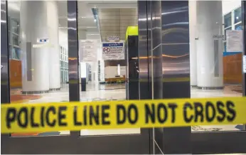  ?? David Paul Morris / Bloomberg ?? Police tape blocks the entrance to the Transbay Transit Center in San Francisco, which was closed due to the discovery of cracked steel beams.
