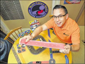  ??  ?? InRoad Toys founder/CEO Andy Musliner came up with a new category of toy out of a roll of tape. Musliner invented PlayTape, paper tape resembling roads or rails that kids can stick on flat surfaces to create roadways for toy cars. The product was...